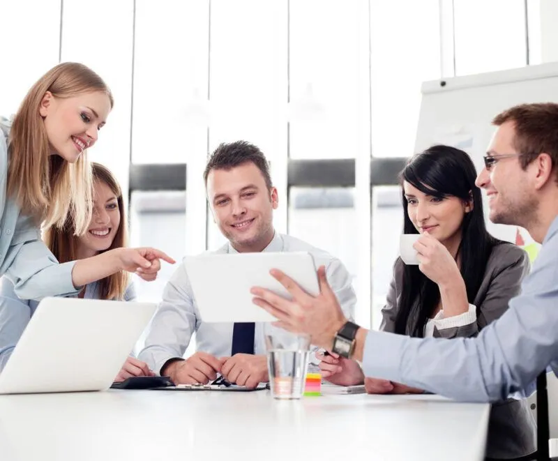 FA Solutions team collaborating around a table